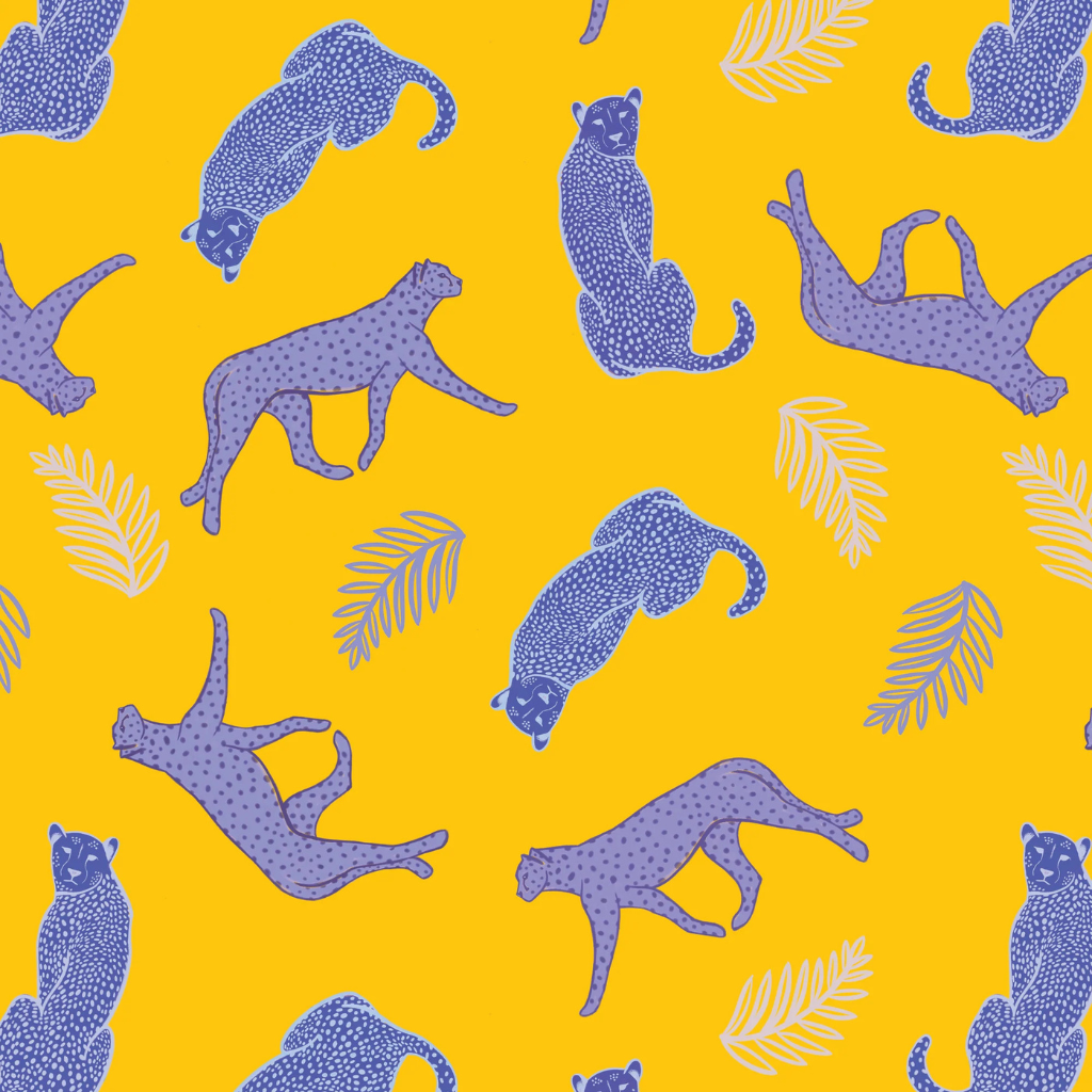 Yellow cheetah peel and stick wallpaper in a tropical-themed room