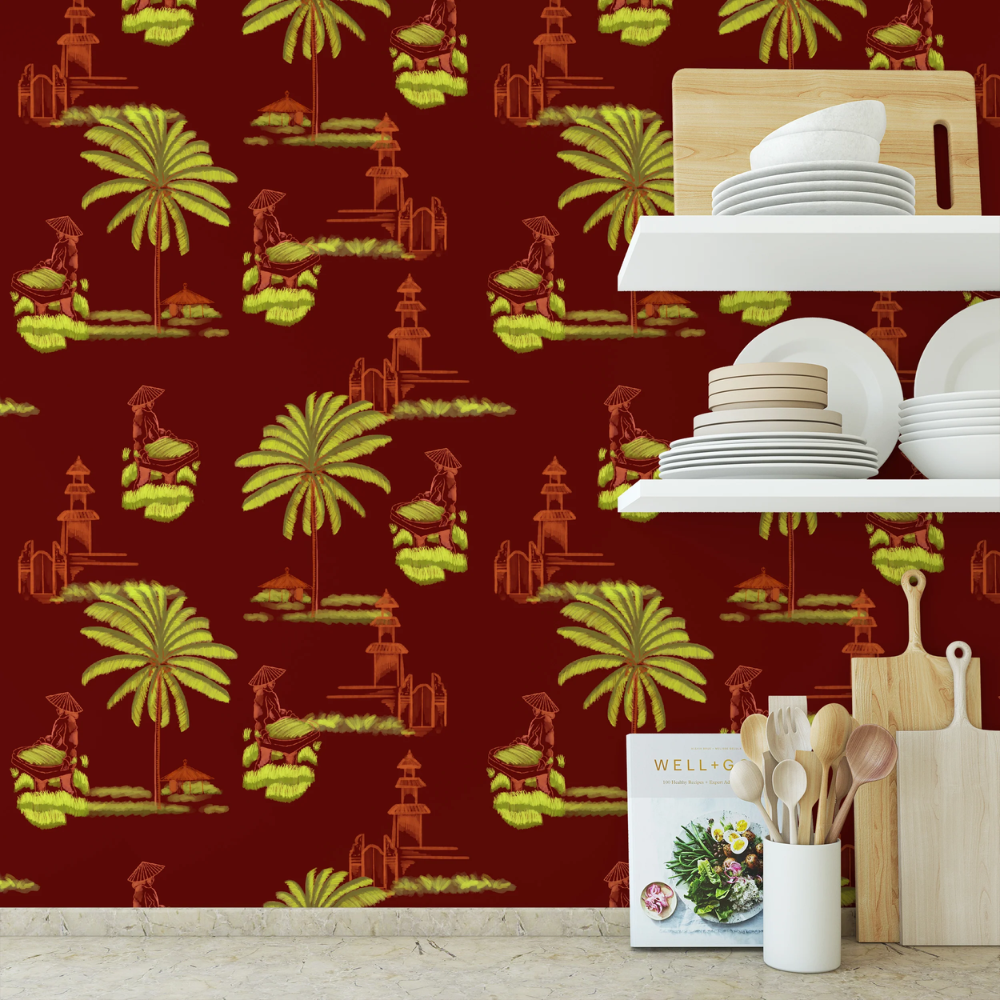 A kitchen counter space features a vibrant maroon wallpaper backsplash with images of Bali Rice Fields in lime green and yellow.