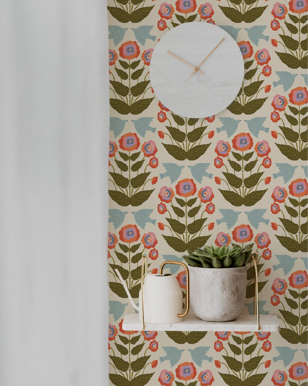 Liberté wallpaper with playful blue birds, symmetrical greenery and colorful flowers on a warm cream background, styled in an elegant room interior | Funky Paper Co