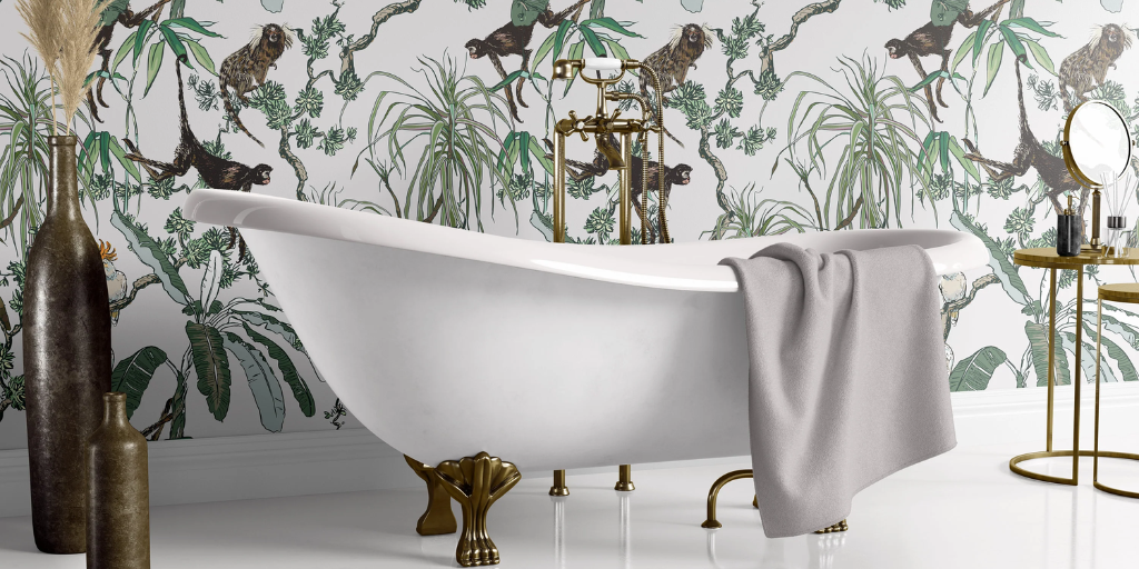 A white clawfoot tub features a Manila white wallpaper background, with monkeys and plants.