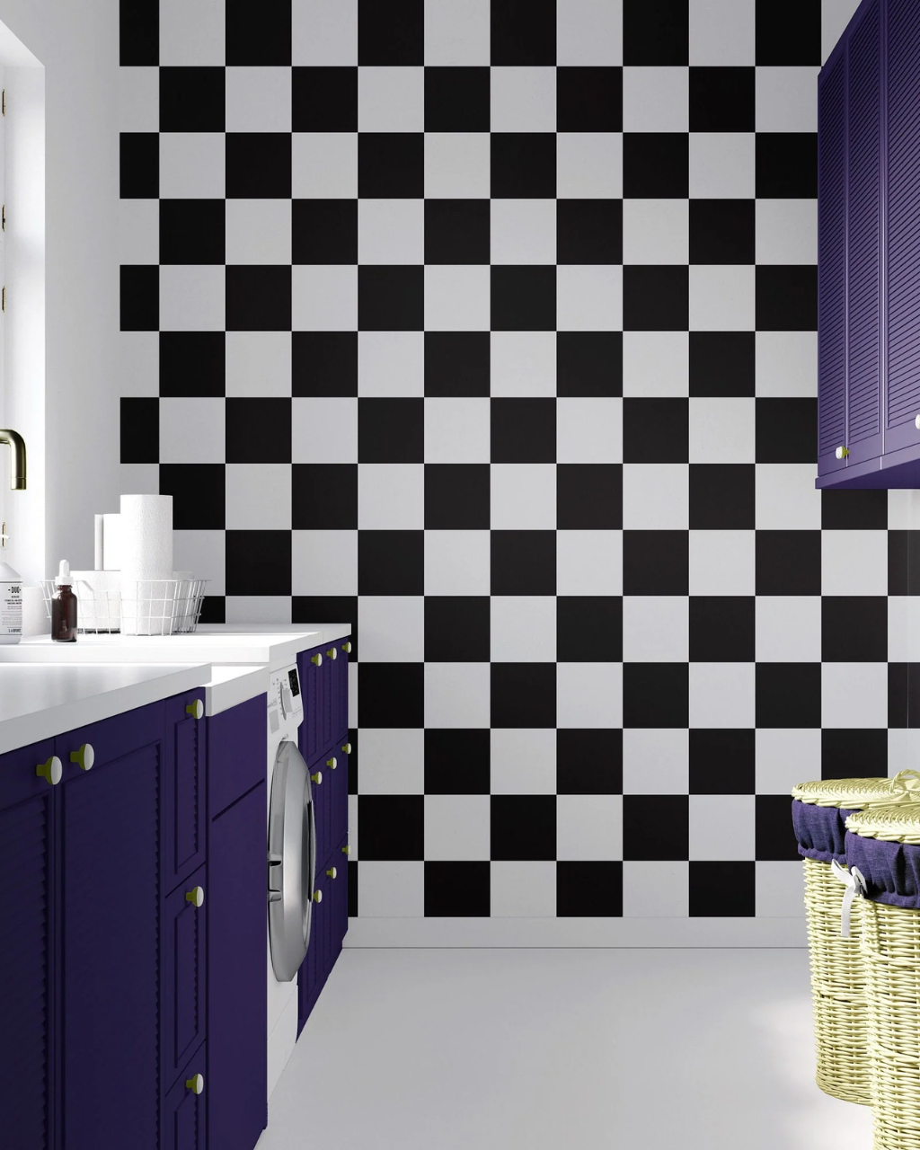 A modern laundry room corner featuring a bold black and white Marin checkered wall, deep purple cabinets, a white countertop, and a washing machine.