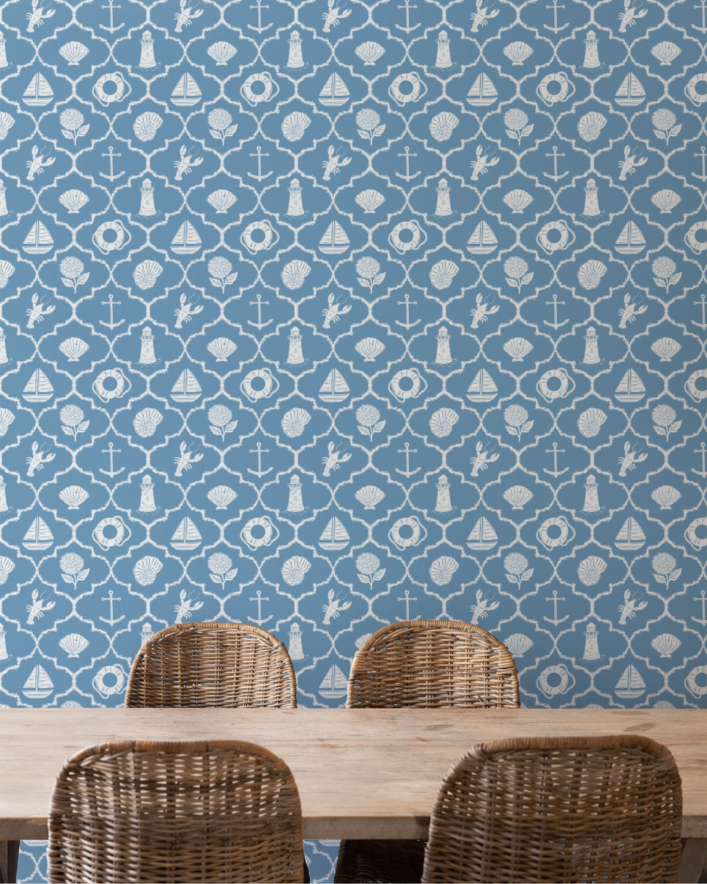 Nantucket preppy wallpaper featuring nautical icons like anchors, lobsters, shells and lighthouses in white on ocean blue, styled in a room interior | Funky Paper Co