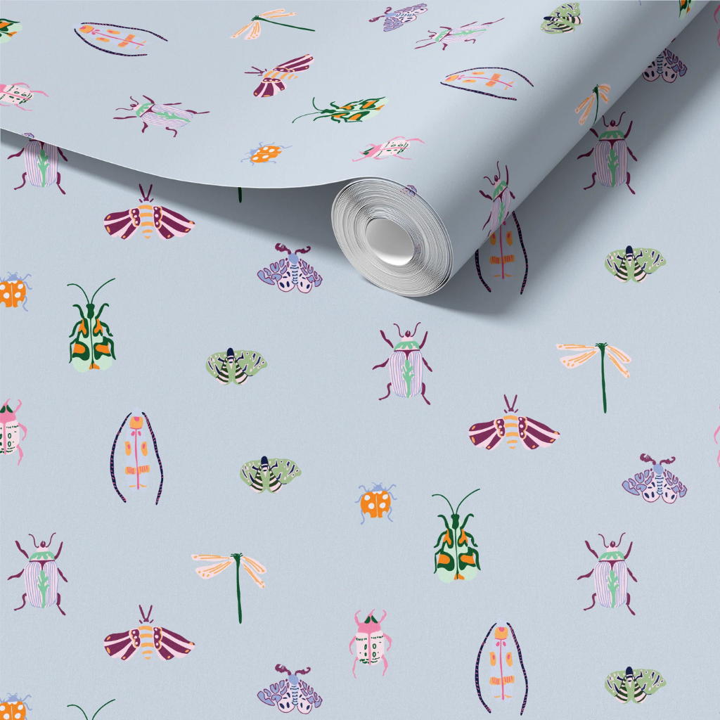 Bugs nursery wallpaper with colorful moths, beetles, and dragonflies on a pastel blue background.
