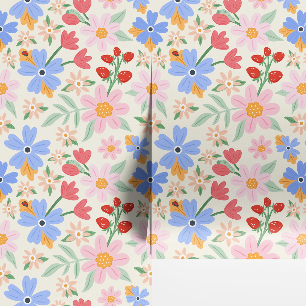 Elodie floral nursery wallpaper with blue and pink blooms, strawberries, and tiny whimsical details on creamy yellow.