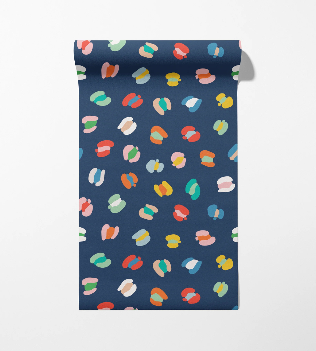 Navy nursery wallpaper with colorful leopard spots for a bold, playful room that grows with kids.
