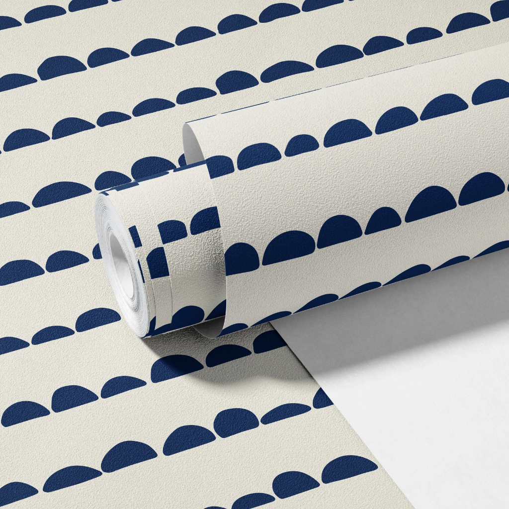 Minimal nursery wallpaper with organic navy bumps forming horizontal lines on a white background.