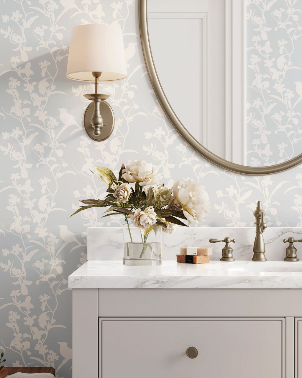 Blue neutral wallpaper with low-contrast bird and vine silhouettes styled in a bright bathroom with white fixtures | Neutral Wallpaper Ideas for Every Room in Your Home by Funky Paper Co