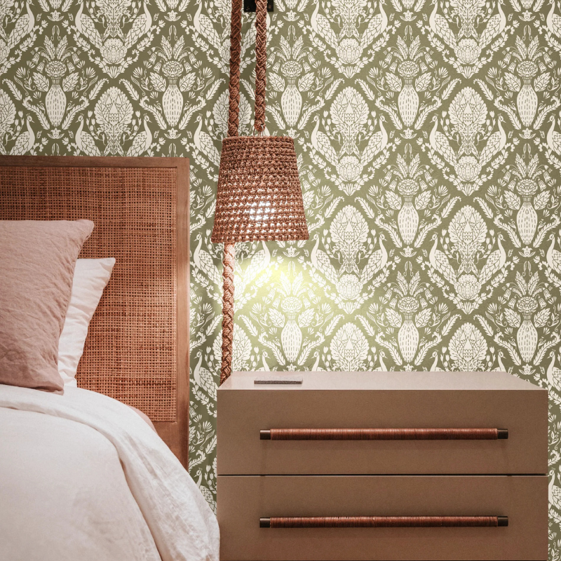 Peacock Damask in Earth Green on linen wallpaper by Funky Paper Co. India-inspired damask print with fabric-like texture in a bedroom.